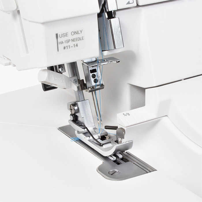 Samodejno vdevanje sukanca v obe igli